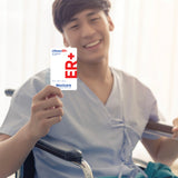 Smiling man in a hospital gown sits in a wheelchair and holds up a Maxicare LifesavER+ card offering ₱50,000 ER coverage.